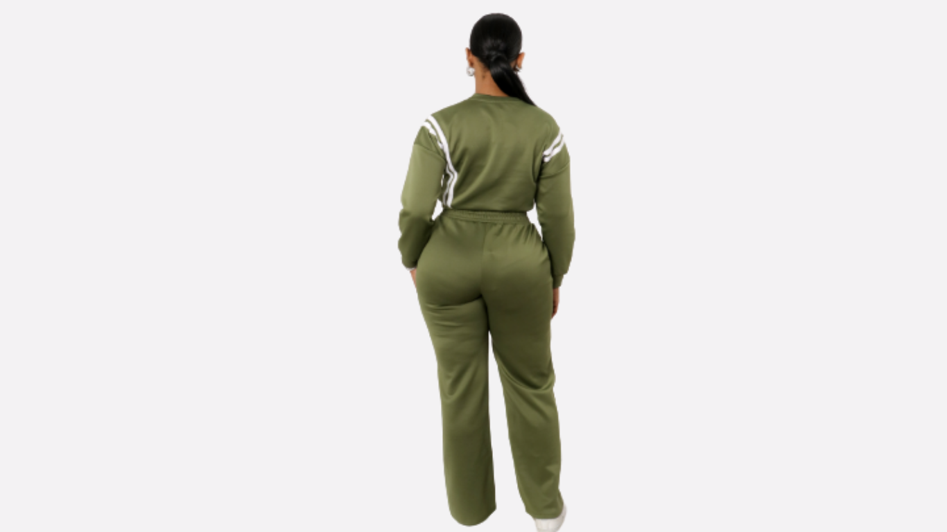 Person wearing a green jumpsuit with white accents on a white background