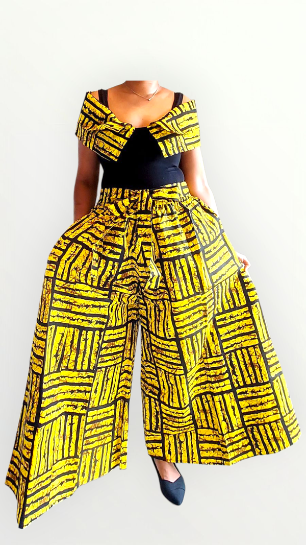 Person wearing a vibrant yellow and black patterned outfit on a white background