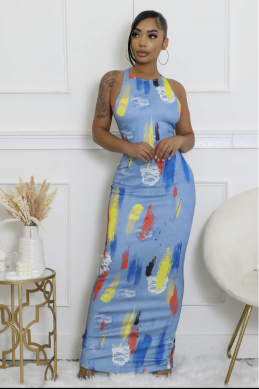 A model wearing a sleeveless, maxi dress with a abstract multicolor print. The dress has a round neckline and a zipper closure at the back.