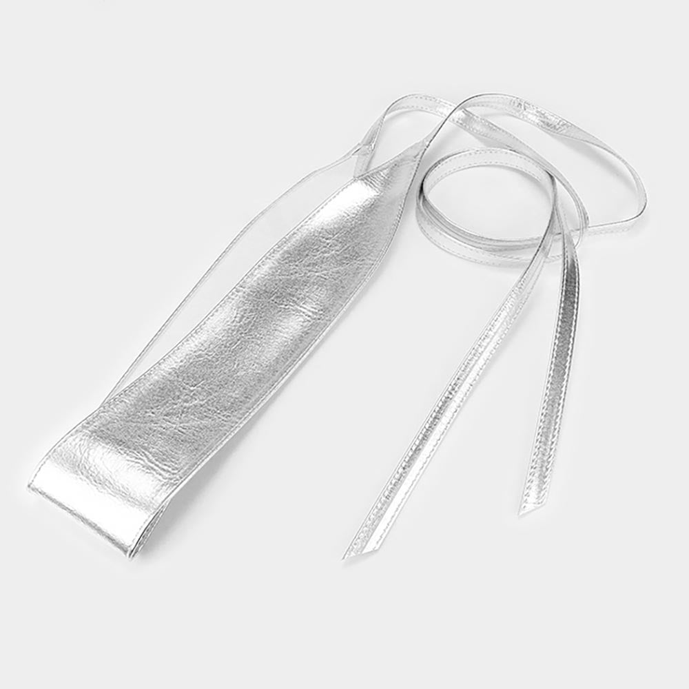 Silver metallic faux leather corset waist belt displayed on a white background, featuring a wide wrap band and long adjustable tie straps.