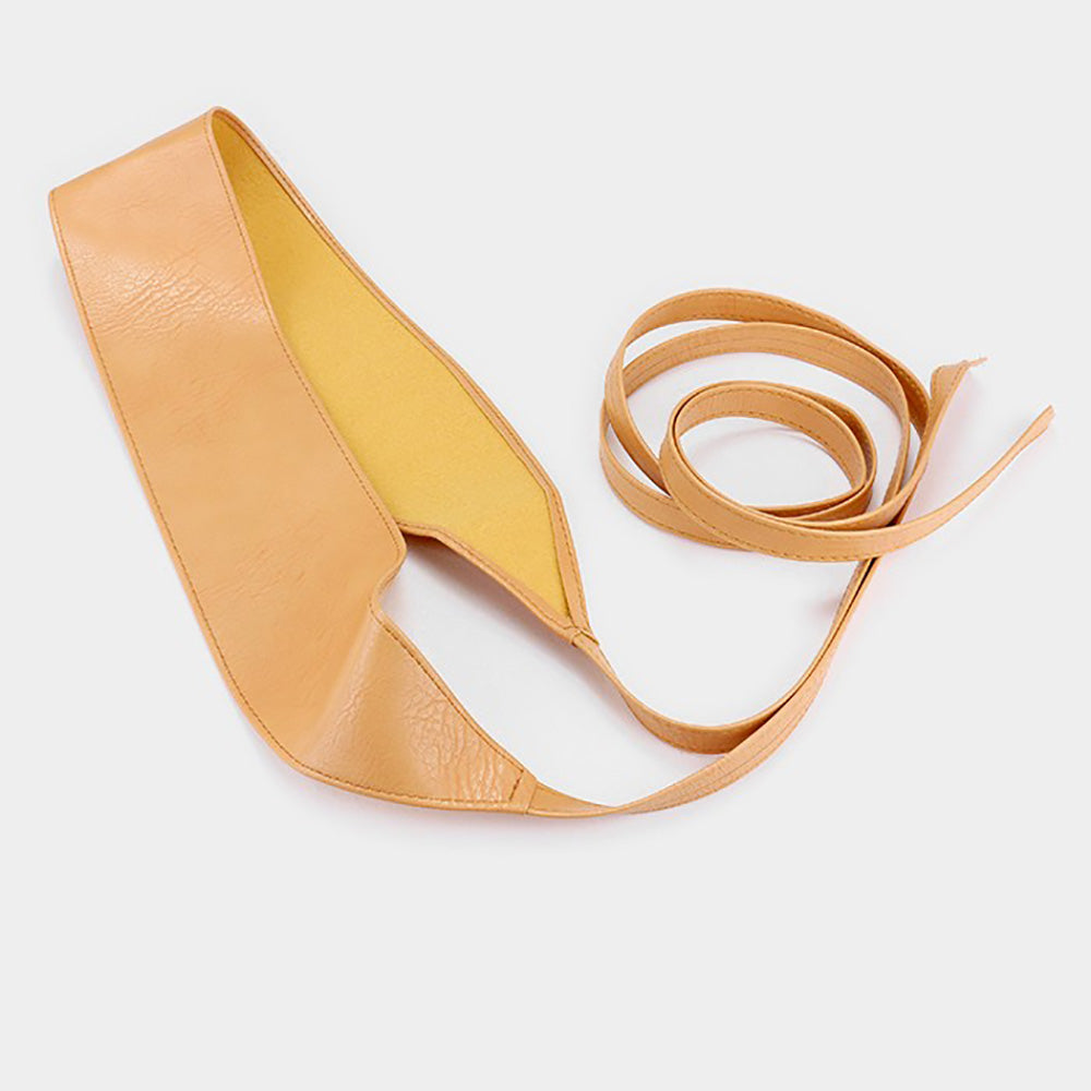 Tan faux leather corset waist belt displayed on a light background, featuring a wide waist panel and long adjustable wrap ties.